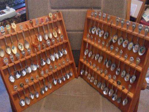 2 WOODEN DISPLAY RACKS FILLED WITH 72 CRESTED TEASPOONS.....