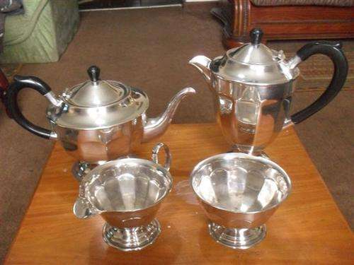 VINTAGE EPNS 4 PIECE TEASET WITH BAKELITE HANDLES.....