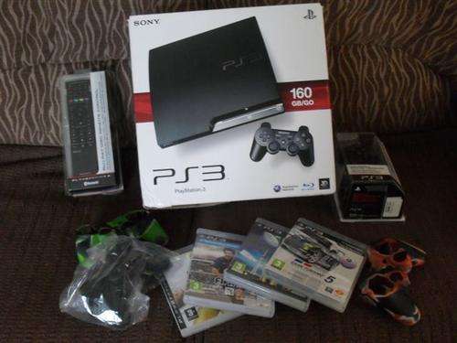 PS3 SLIM 160 GIG CONSOLE WITH ACCESSORIES AND 4 GAMES......