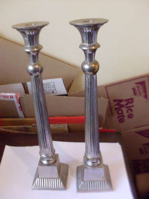 A PAIR OF TALL PILLAR STYLE S/P CANDLE HOLDERS