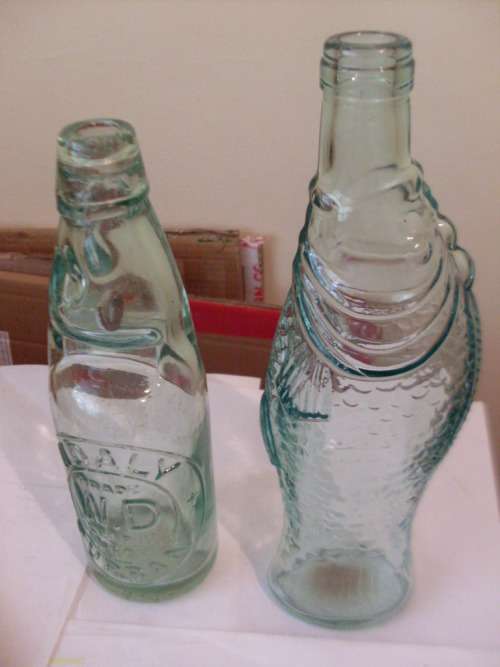 2 VINTAGE GLASS BOTTLES ( 1 HAS MARBLE STOPPER )