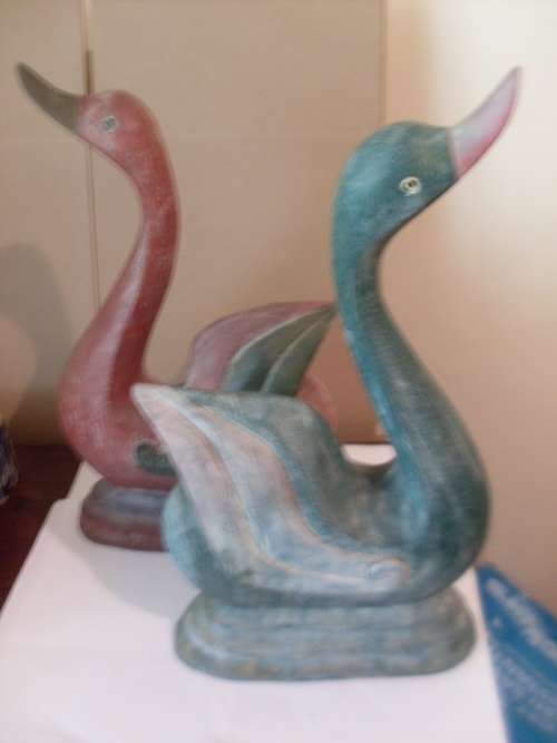 A PAIR OF 2 HUGE CARVED WOODEN DUCK ORNAMENTS
