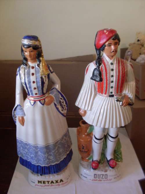 2 HUGE MALE AND FEMALE FIGURINE DECANTERS MADE IN ITALY.....46 CM TALL EACH....EMPTY....