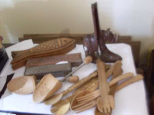 A COLLECTION OF WOODEN BOXES AND DECORATIVE SPOONS ETC