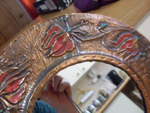 A LOVELY ROUND COPPER WITH ENAMELLED FLOWER DESIGN MIRROR READY TO HANG