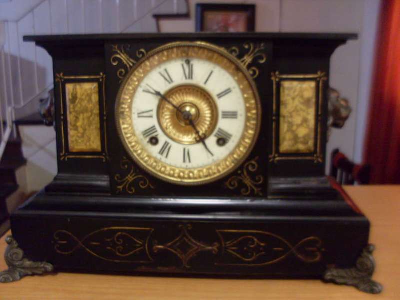 WOW ORIGINAL VINTAGE ANSONIA BLACK CAST IRON MANTLE CLOCK/ALSO HAS CAST LIONS ON THE SIDES...9.3 KG