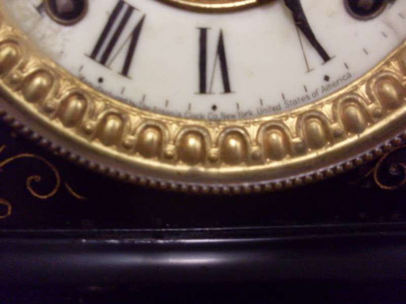 WOW ORIGINAL VINTAGE ANSONIA BLACK CAST IRON MANTLE CLOCK/ALSO HAS CAST LIONS ON THE SIDES...9.3 KG