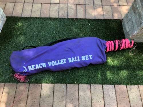 Beach volleyball net and polls