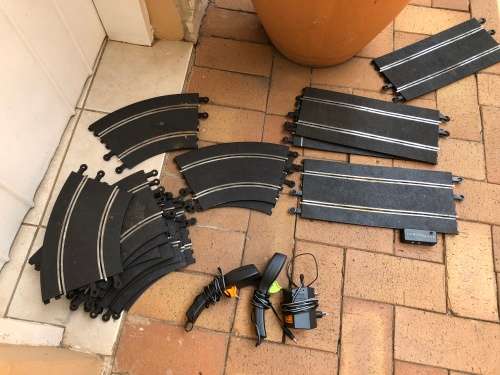 Scalextric tracks with power unit and controllers