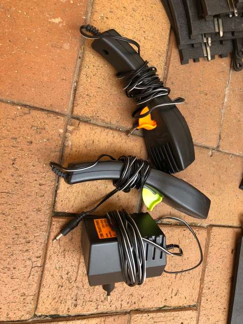 Scalextric tracks with power unit and controllers