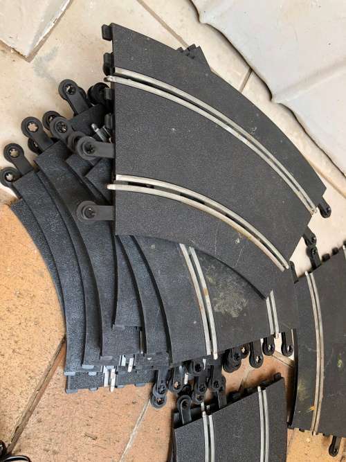 Scalextric tracks with power unit and controllers