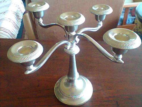 A Old Vintage Silver Plated Candle Stick which holds 5 Candle's In Good Condition.