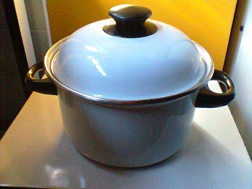 A Old Vintage White Enamel Pot medium size with a few chip's, well used good condition for it's AGE