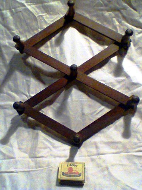 A OLD Vintage Expandable Coat/Hat rack, can be Hung Horizontal or Vertical, In Excellent Condition .