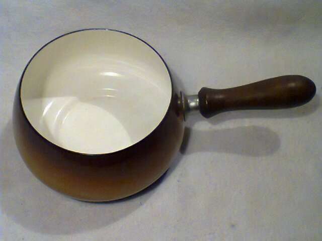 A Vintage Enamel Pot with wooden Handle In good condition for it's AGE.