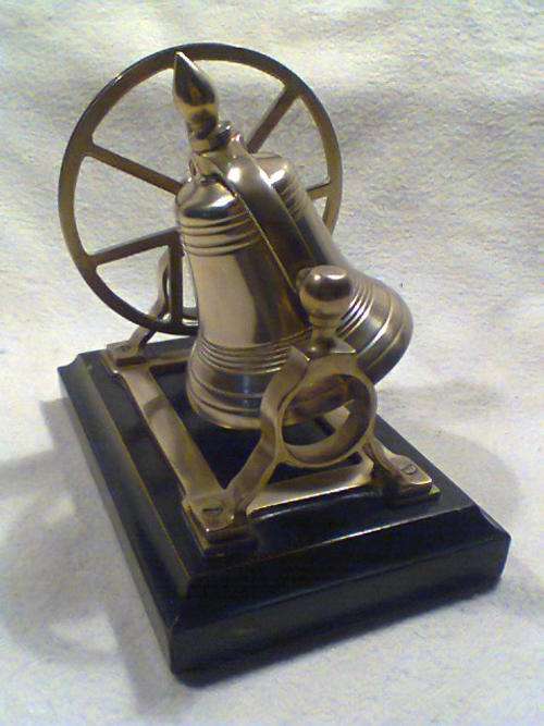 A Large Vintage Brass Dinner Bell Wheel Bracket with Church Tower Bell motif with a loud clear Ring.