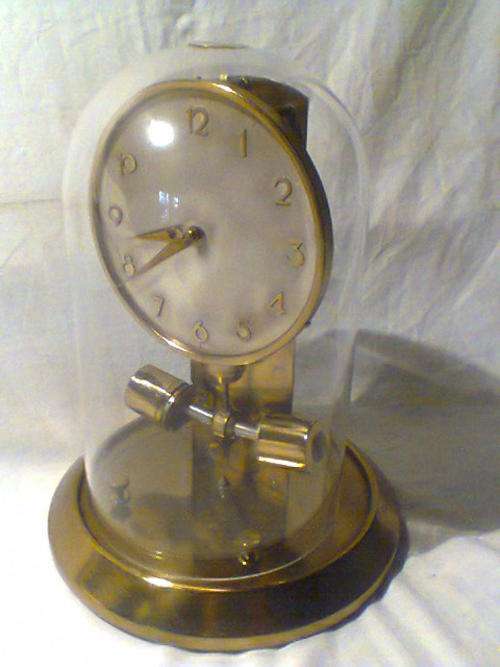 A Old Vintage "JUNGHANS" ATO Glass Dome Mantel Clock. It has a Date 11-09-54 inscribed on the Rim.