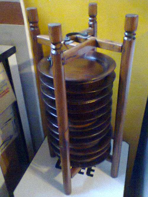It was used as a Display Item, 65Yrs Old from Indonesia Set of 11 Plates in a Carrying Cage Stand.
