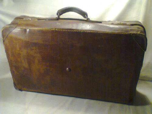 A Very Old Vintage All Leather Suitcase with Original Lining. Over 80 years old.In Fair Condition