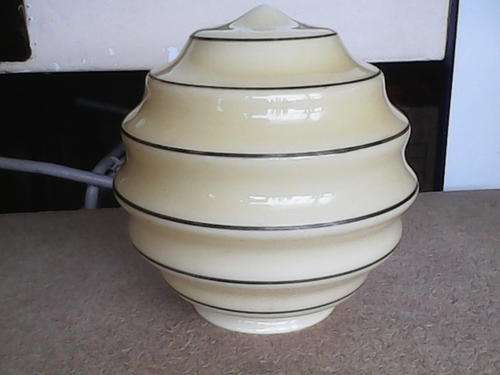 A very collectible 1920's Yellow Bee Hive Glass ceiling light shade. In good condition for it's AGE.