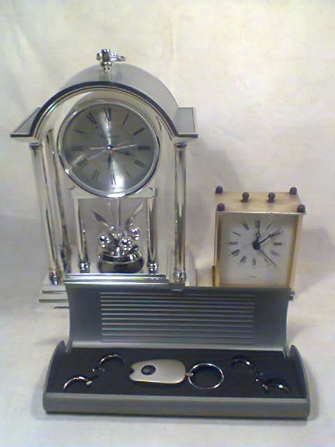 A working "Recardo" mantel Clock with a Alarm Plus a Brass Carrage Clock & a Key ring set with Light