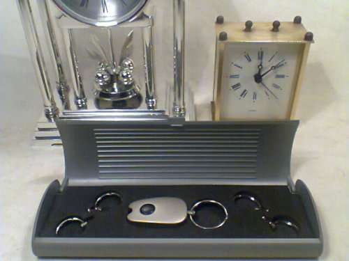 A working "Recardo" mantel Clock with a Alarm Plus a Brass Carrage Clock & a Key ring set with Light