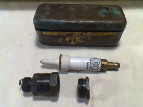 A unusual Lot "Man Cave" A New 1940's"ALDOR" Thermo-Reactor Oil Firing S/Plug in old tin+ B/Shell.