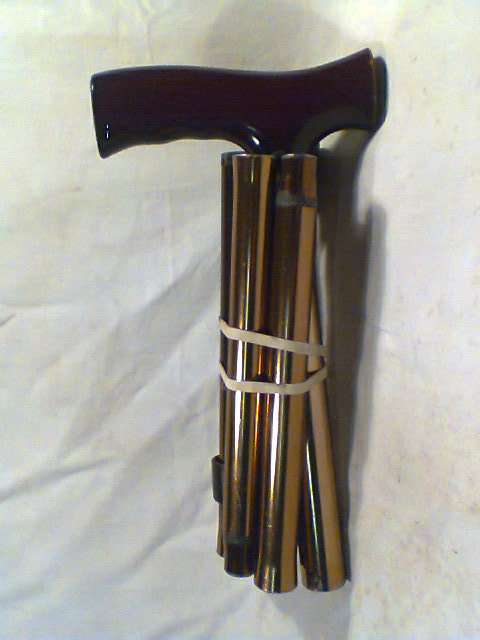 A Vintage Collapsible fold-up steel adjustable Walking Stick. Adjusts down from 945mm to 840mm