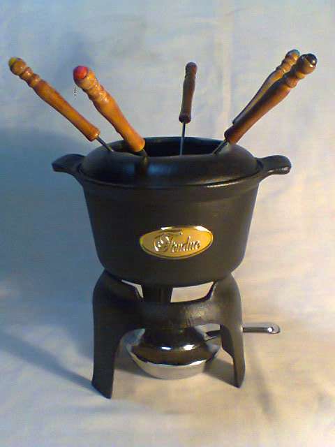 A Almost new never Used Cast Iron complete "Premier FONDUE set" Ready for U to set out at the party.