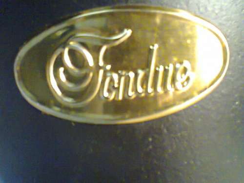 A Almost new never Used Cast Iron complete "Premier FONDUE set" Ready for U to set out at the party.