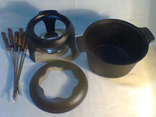 A Almost new never Used Cast Iron complete "Premier FONDUE set" Ready for U to set out at the party.