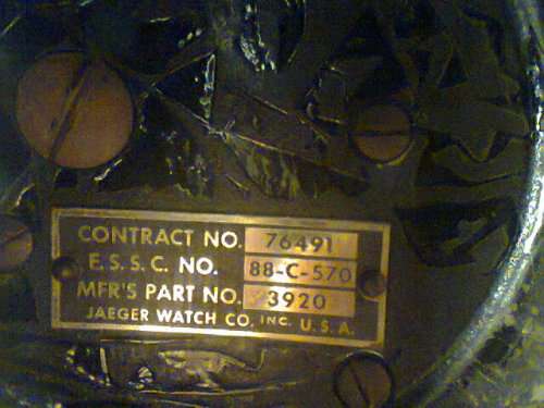 U.S.A.Navy Military Jaeger 8 Day Aircraft Clock made in Switzerland in 1930 mounted in a Wood frame.