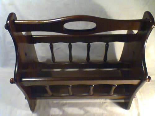 A Vintage Magazine rack in outstanding condition. Ideal for display in the lounge.Size:44cm L 39H