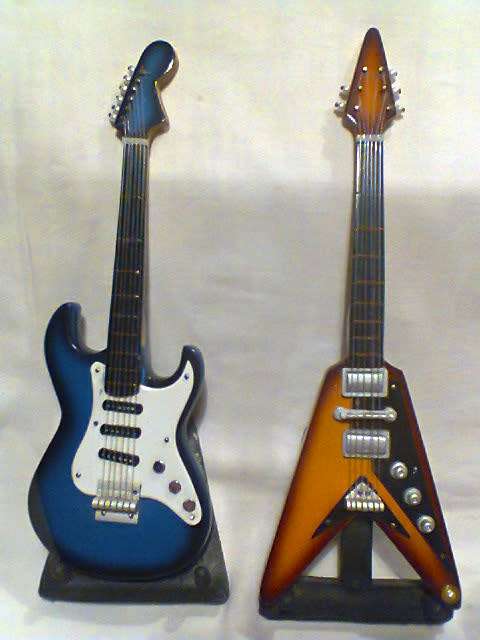 For the Man Cave to display 2 Miniature Guitars on stands Sizes: 210mm Long in Used s/hand Order