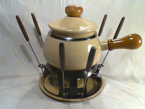 A Almost new/Used complete Enamel "FONDUE set" in Original Box. Ready for U to set out at the party.