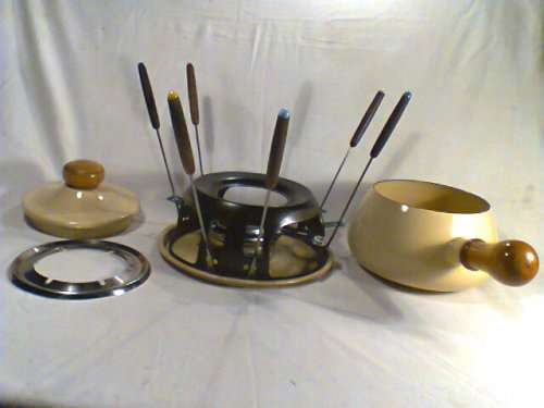 A Almost new/Used complete Enamel "FONDUE set" in Original Box. Ready for U to set out at the party.