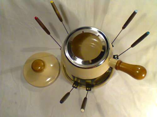 A Almost new/Used complete Enamel "FONDUE set" in Original Box. Ready for U to set out at the party.