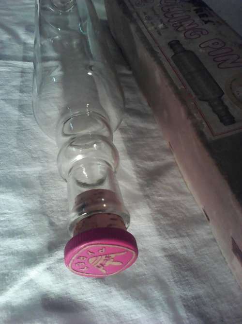 A 1950's "PYREX" glass rolling pin with cork and in original box. Length: 450mm. In excellent order