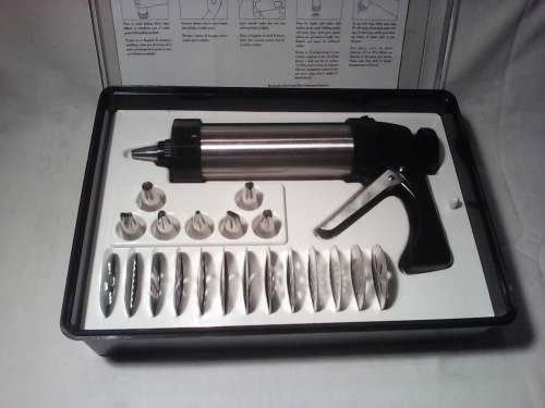 Vintage Hand held Cookie press in box and very neat with instructions & in used second hand order.