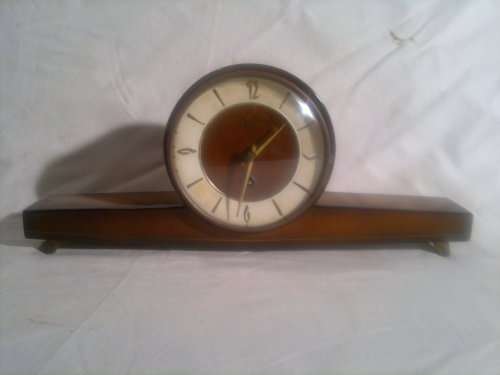 A Vintage "Cyrano" with a "Lauffer" Western in Germany Mantel Clock in used condition.