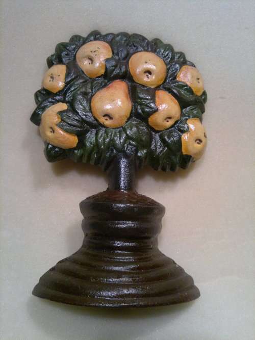 A Beautiful Cast Iron door stop with Fruit Tree "Pear" motif. In Very good condition.