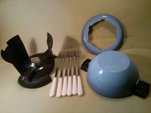 " Le Creuset"   R2495- on eBay.WoW Enamel and Original Fondue Set plus 6 Stamped "Le Creuset" Forks.