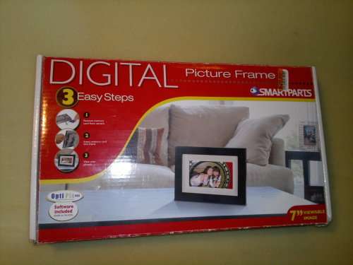A  7" Digital Picture Frame with Remote, charger, bracket, Wires, books and in good working order.