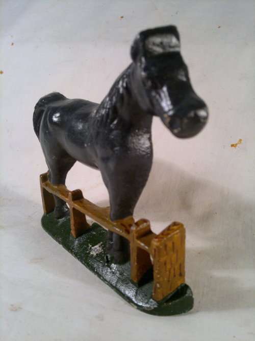 A collectible Vintage "Horse" motif Cast Iron Door stop.Ideal for display. Sold as used second hand.