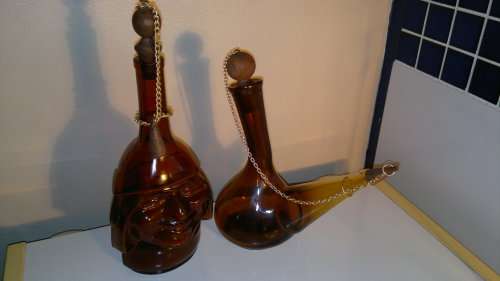 WoW 2 Unique Brown bottles. A Monk made in ITALY and a Wine flask with stopper & chain. Sold as used