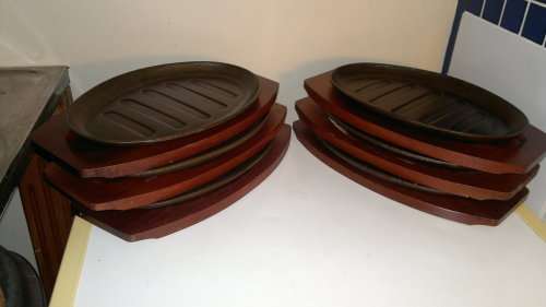 Vintage. 6 Cast Iron on wooden bases Stake Plates. Ideal for the family braai. Sold as used s/hand.