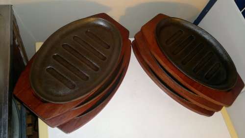 Vintage. 6 Cast Iron on wooden bases Stake Plates. Ideal for the family braai. Sold as used s/hand.