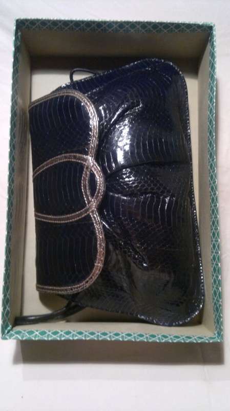 A Vintage " J. RENEE' " from an estate of a Opera singer. It's Hand made Genuine Snake.