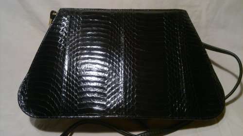 A Vintage " J. RENEE' " from an estate of a Opera singer. It's Hand made Genuine Snake.