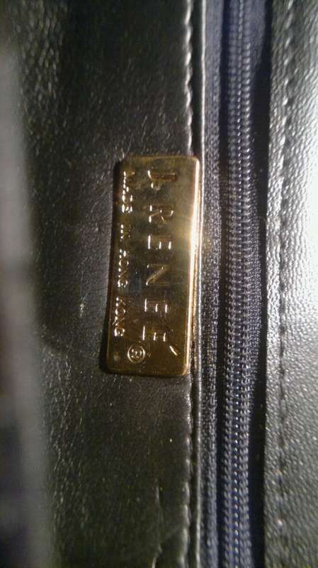 A Vintage " J. RENEE' " from an estate of a Opera singer. It's Hand made Genuine Snake.